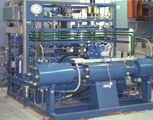 Air-driven pneumatic booster assembly, a component that generates high-pressure liquid for an isostatic press.