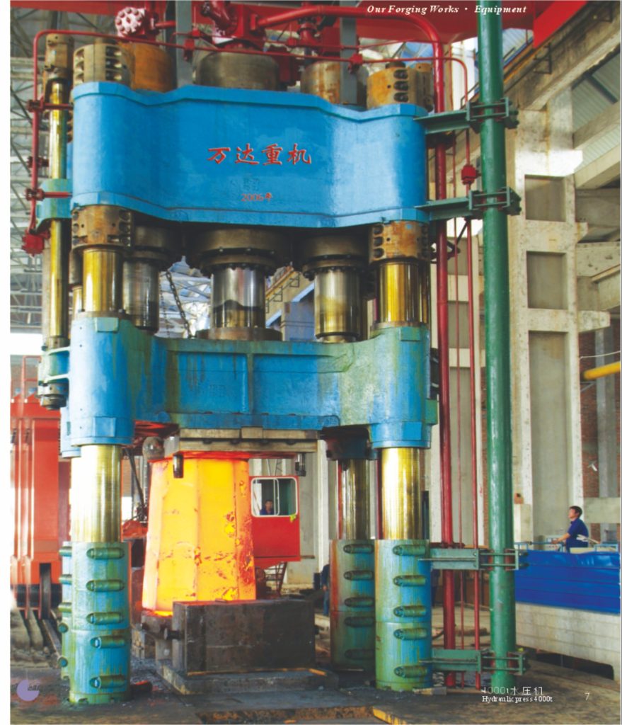 The massive 5000-ton hydraulic forging press, showing its multi-column frame and the main ram.