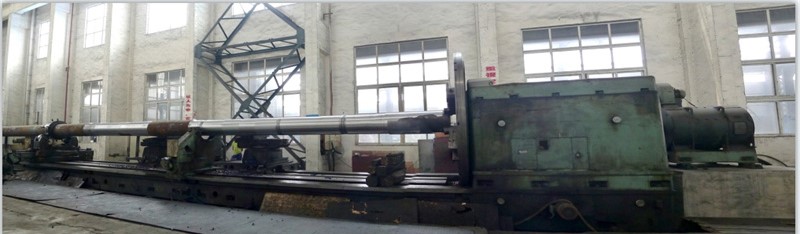 The C61300/3000 heavy-duty horizontal turning lathe, showing its massive headstock, chuck, and long bed.