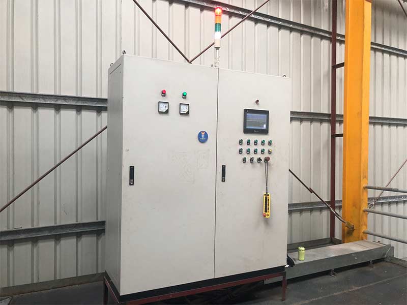 A custom-built electrical control cabinet for isostatic presses, featuring an integrated PLC and HMI for precise process control.