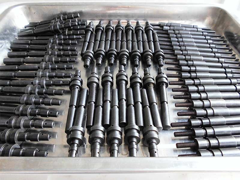 A precision-machined supercharger signaling rod and a pressure relief valve plunger, two critical components for the control and safety systems of isostatic presses.