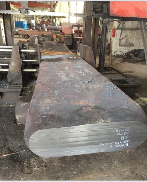Heavy-duty forged column, a structural support for an isostatic press frame.