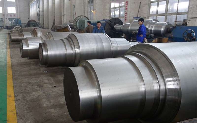 A heavy-duty steel conveyor track roller with integrated sealed bearings, designed for a material handling system.