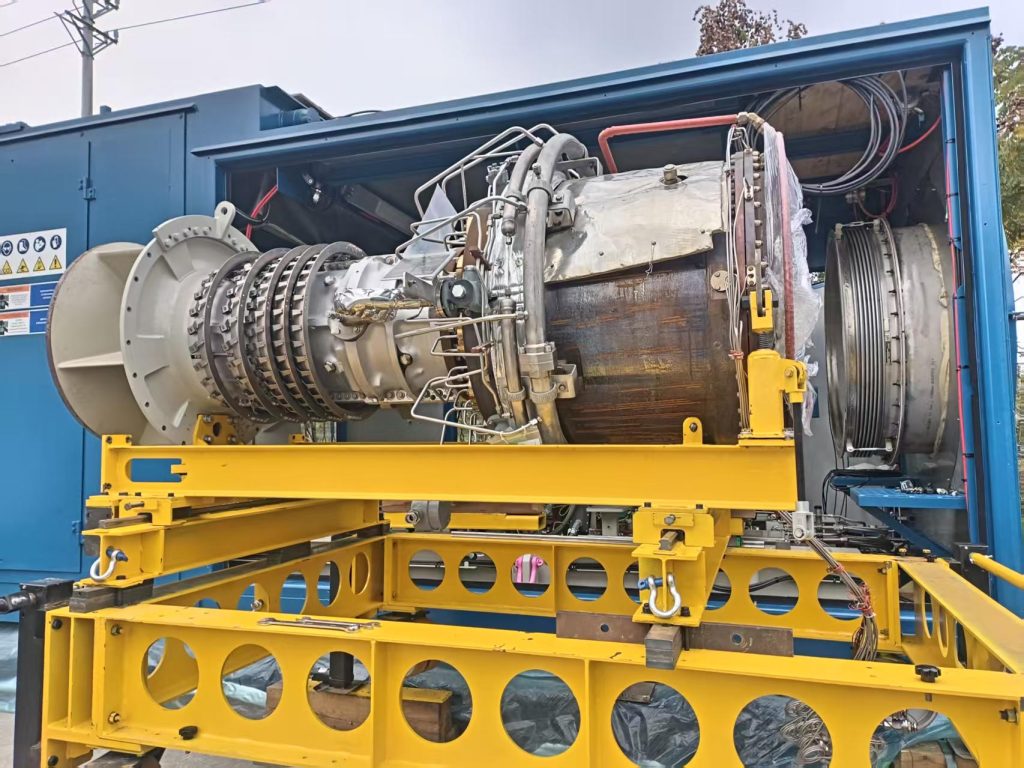 A collection of genuine Solar Taurus T70 gas turbine spare parts, including turbine blades and fuel nozzles.
