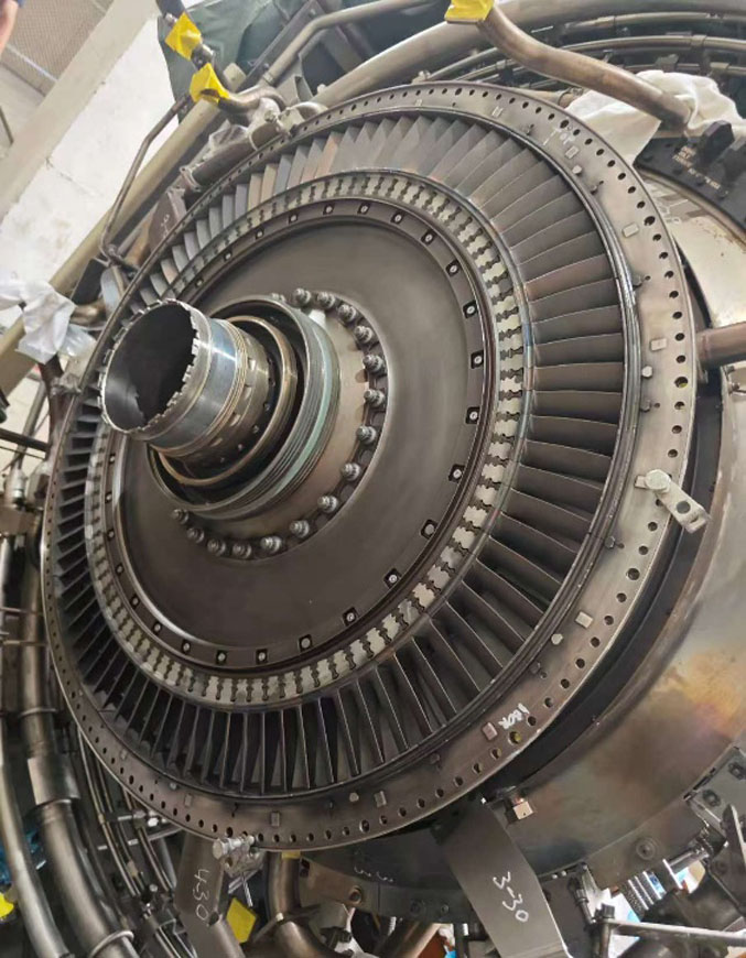 A collection of genuine GE LM2500 spare parts, including turbine blades and nozzles, ready for shipping from a reliable supplier.